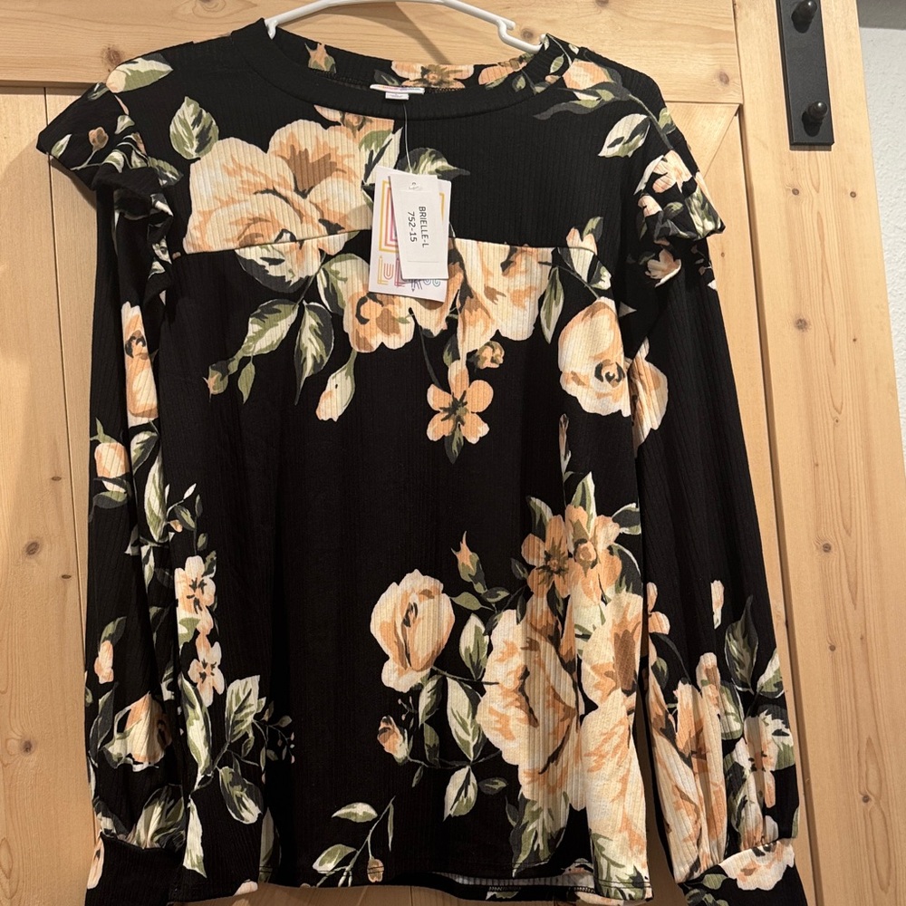 LuLaRoe Black and Cream Floral Blouse